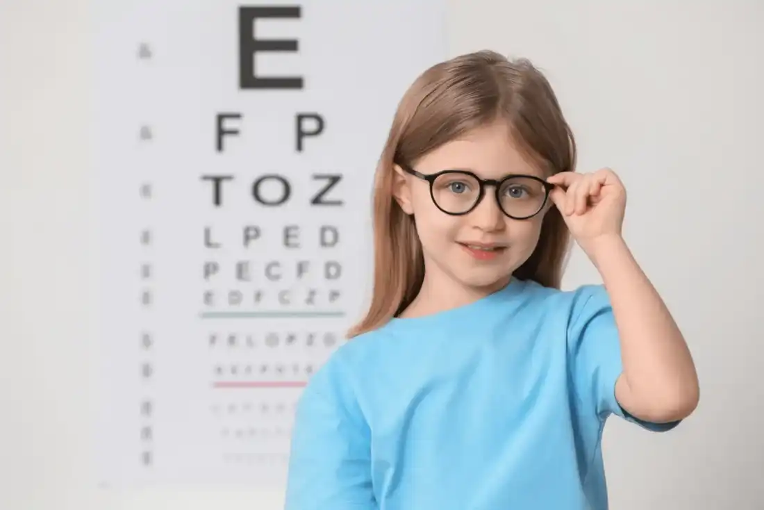 Child wearing glasses during pediatric eye care in Syracuse, Utah